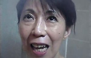 Asian granny sucking cock in the shower