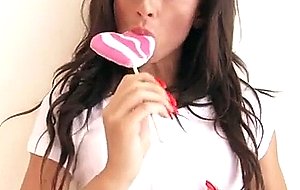 Stunning girl princess sofie licks a lolly while m