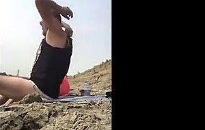 Fat wife having some sweet time on the beach with a hubby