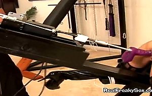 Blonde gets fucked doggystyle with a vibrator machine