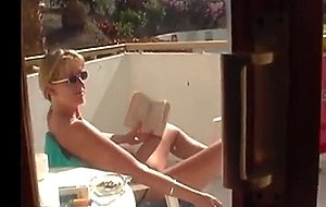 Topless tart in tenerife flashes her pussy  
