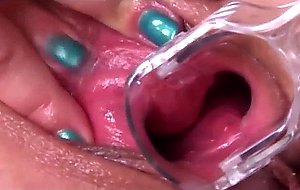 Spreads her pussy with speculum  