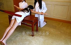 Asian girl gets a tradittional spanking punishment  