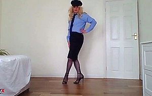 Stripping out of a police uniform with black basque