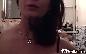 Hot brunette shows her big tits on camera