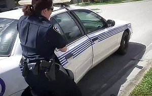Mechanic dude gets surprised with two horny cops that want his cock instead of arresting him