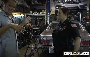 Mechanic dude gets surprised with two horny cops that want his cock instead of arresting him