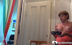 Solo chick filming herself while masturbating passionately
