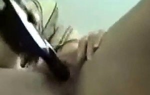 Amateur asian fucks herself with a hair brush