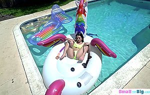Petite Riley Jean toys pussy in the pool and sucks big cock