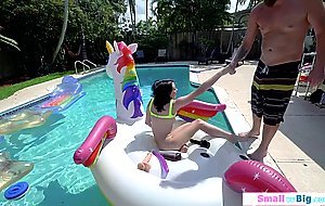 Petite Riley Jean toys pussy in the pool and sucks big cock