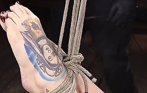 Tattooed busty slave gets toyed