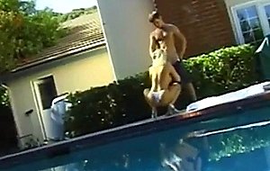 Horny young blonde with beautifull tits drops to knees and gives head by pool