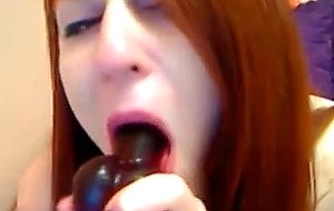 Cute redhead plays with her vibrator