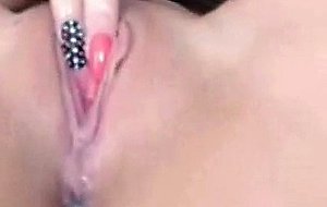 Horny chick fingering pussy