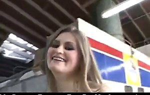 Horny blonde slut outside at a car workshop