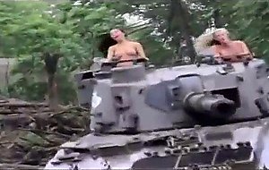 Nude hotties driving a tank!