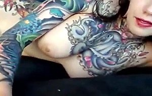 Tattoo babe inserts gem anal plug and plays with pussy