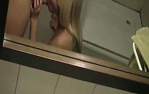 Blond beauty gets cum shot in bathroom