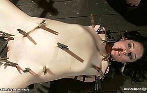 Bound slave in metal body clamped