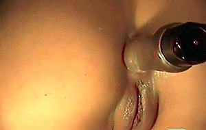 masturbating with toy in her ass