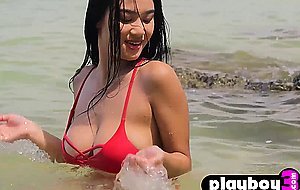 Petite Asian teen model posed on the beach and revealed her stunning body