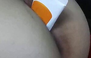 Asian girl fucks herself with a cream tube on a webcam