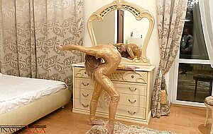 Gymnastic, ballerina in a golden dress