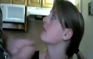 Young wife gives head in the kitchen