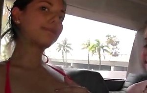 Brunette amateur flashes tits and ass during cash stunt
