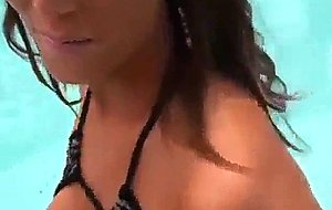 Brunette slut sucks cock in the pool